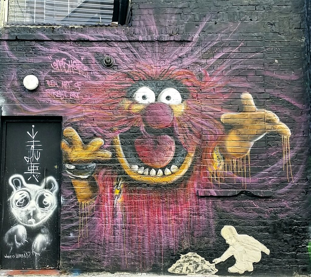 Scary subject in street art piece in Camden